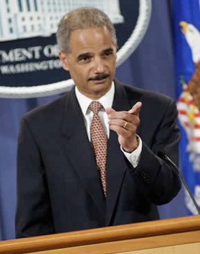 US attorney general Eric Holder announcing criminal charges against Toyota